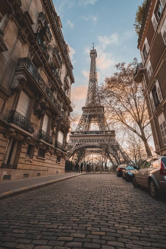 Eiffel Tower in Paris, France, taken from cobblestone street