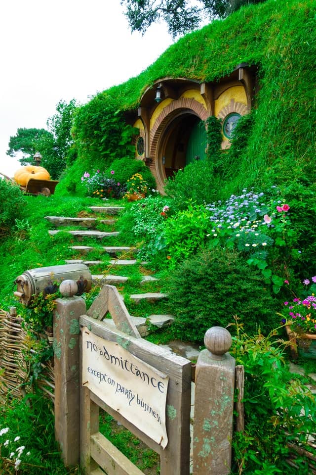 Hobbiton Movie Set in New Zealand, with steps leading to circular door